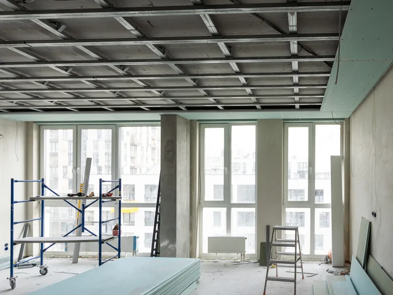 Commercial tenant space with new drywall going up during a fit-out